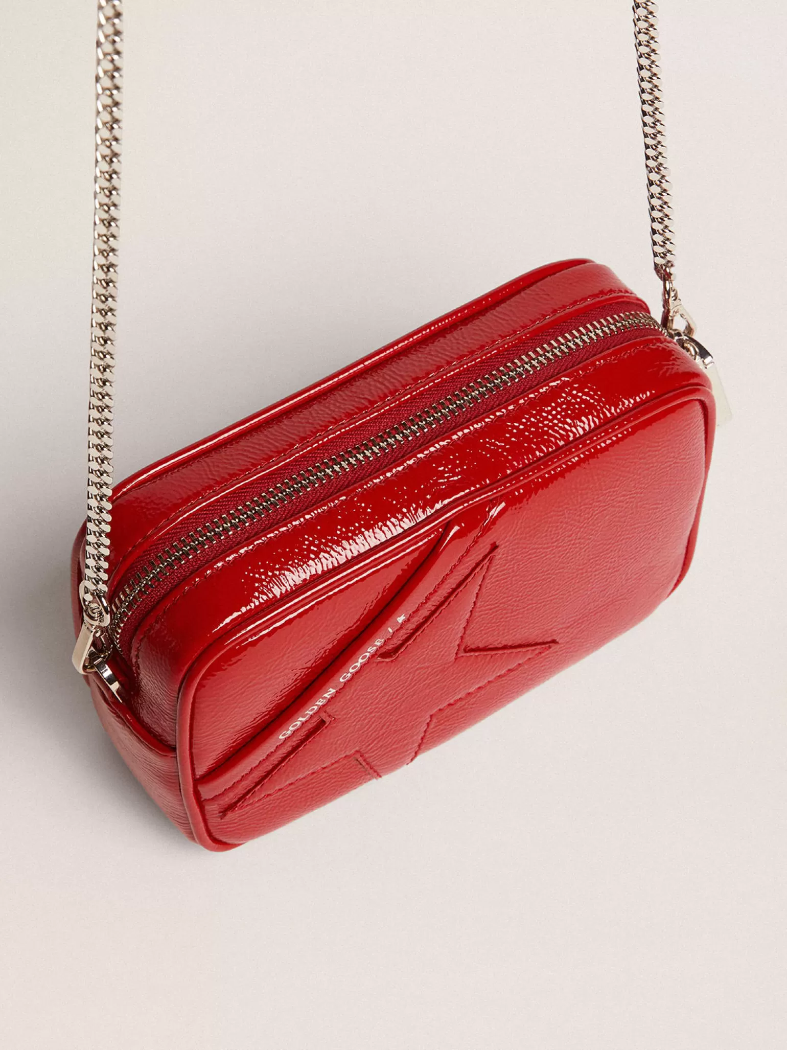 New Bolsa Mini Star feminina de couro pintado vermelho com estrela tom sobre tom MULHER Minibolsas | Bolsas tiracolo
