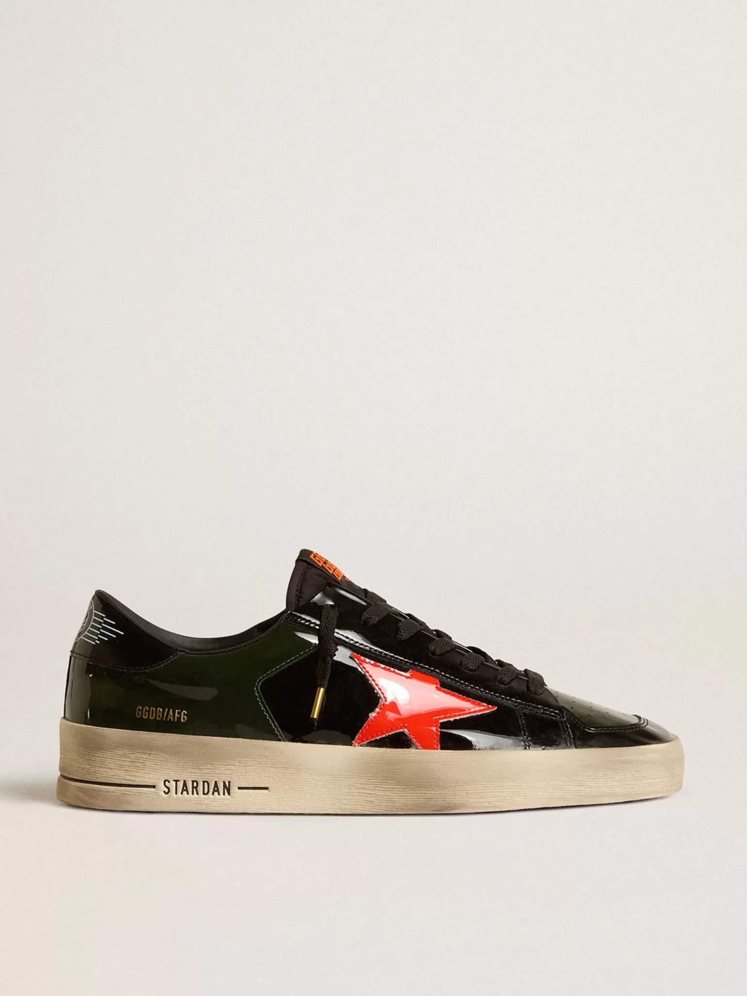 Store Stardan Masculino de couro envernizado preto e verde com estrela laranja Stardan